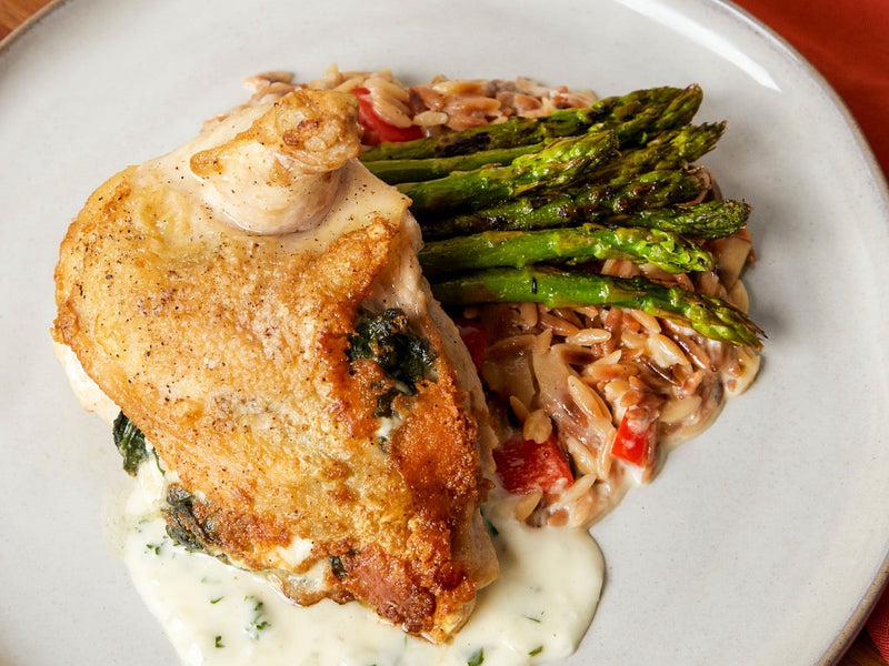 Mediterranean Stuffed Chicken with Orzo and Charred Asparagus